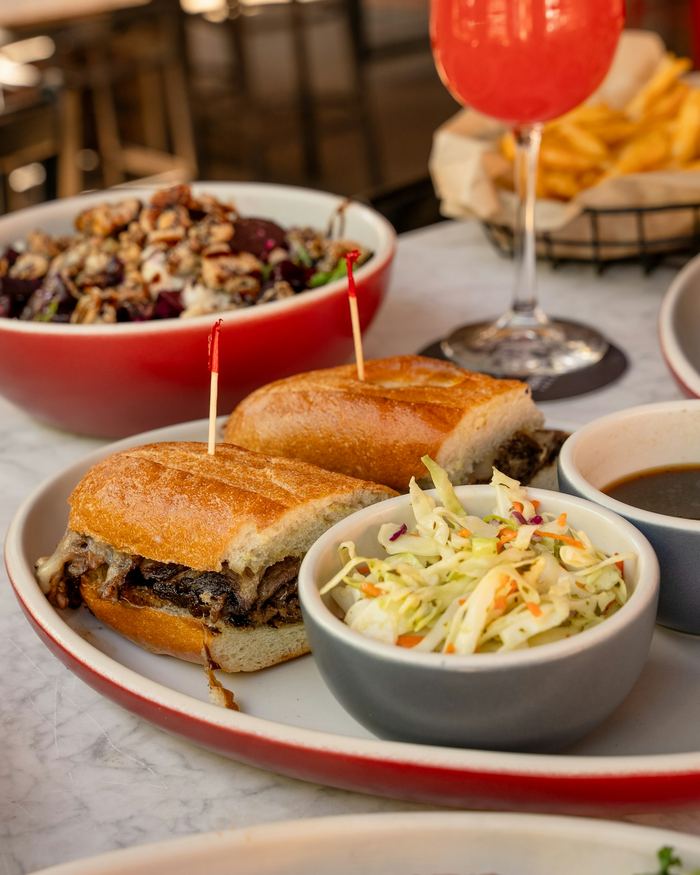 French dip with au jus and coleslaw